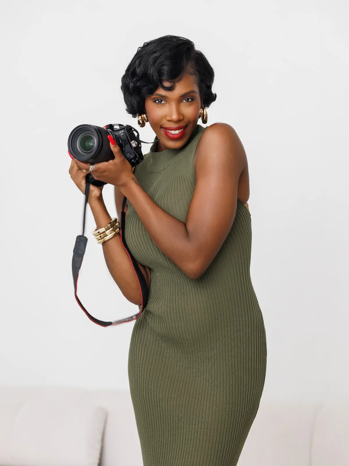 Jasmine smiling with her camera raised