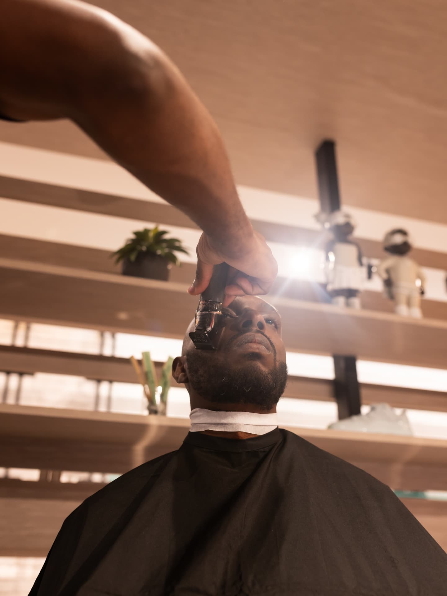 Barber lining up a guest's beard